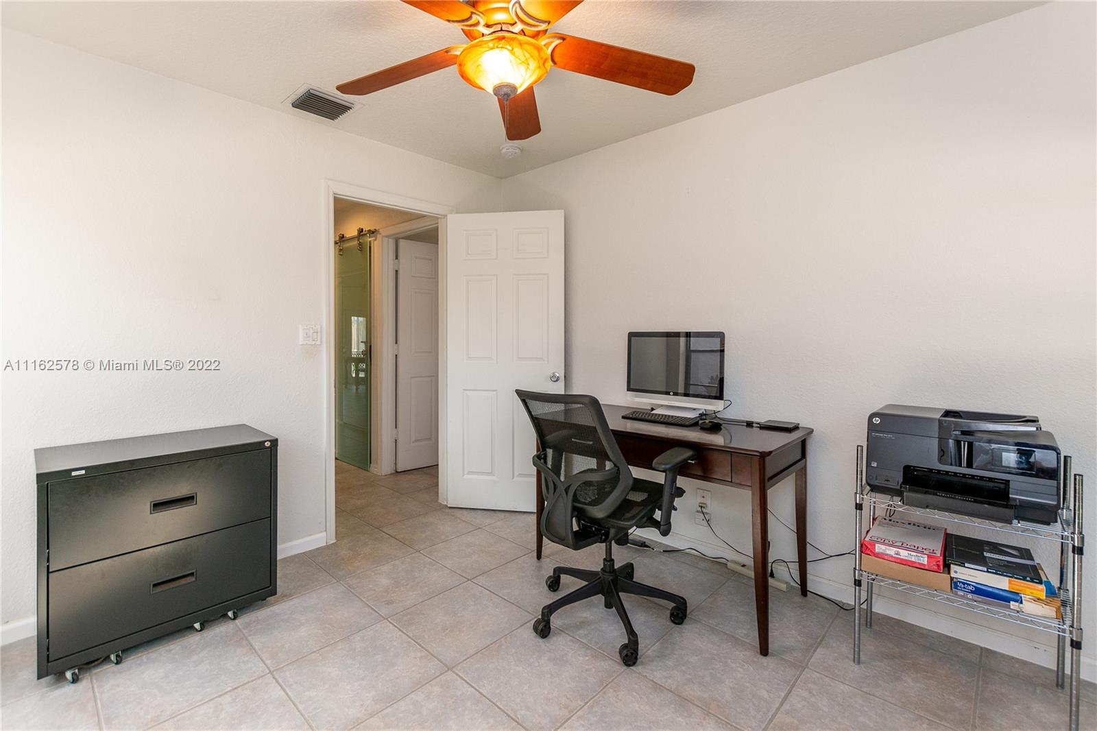 11612 Quiet Waters Lane Boca Raton, FL 33428 - Photo 43 of 70 a view of a workspace with furniture
