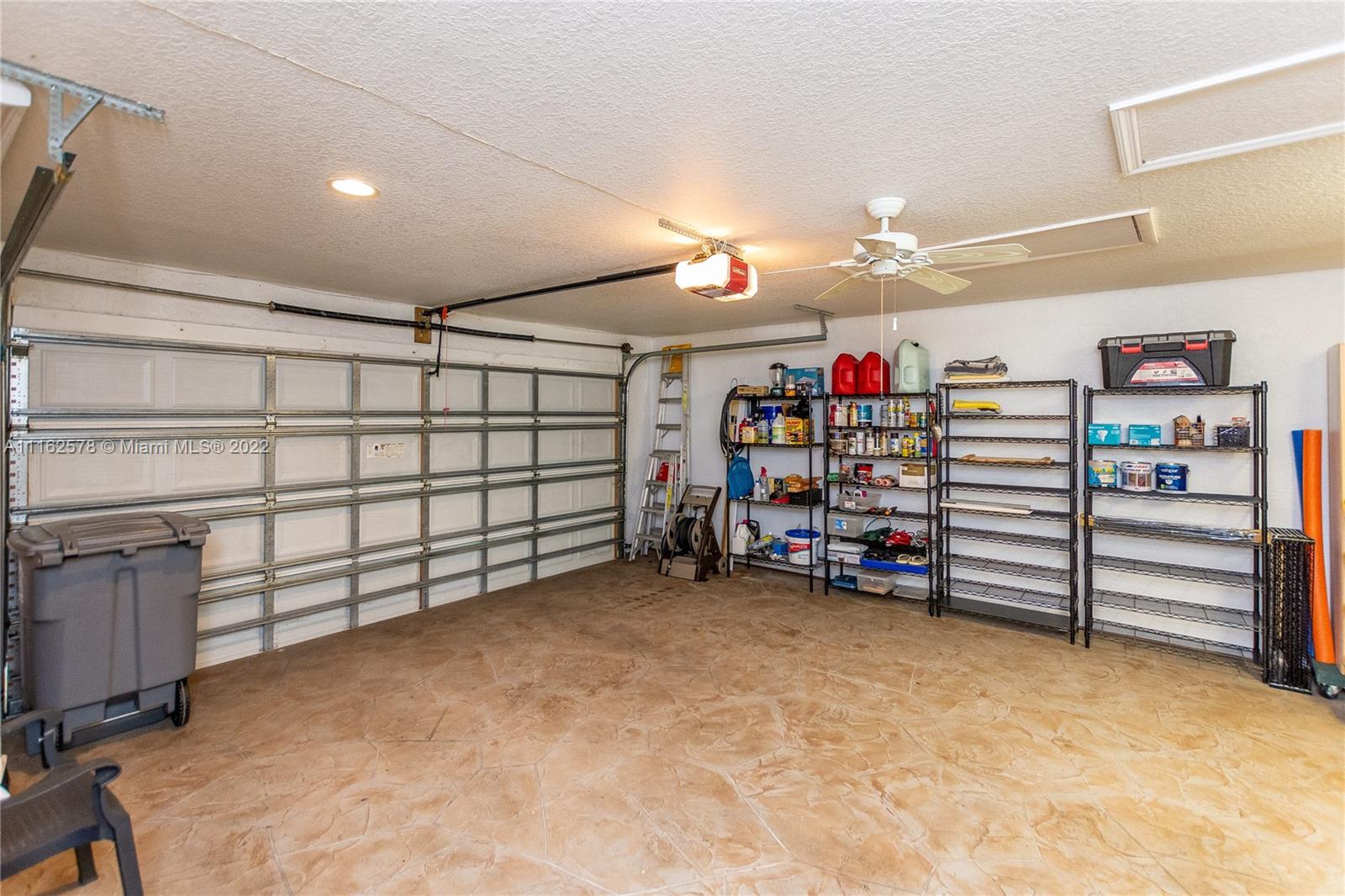 11612 Quiet Waters Lane Boca Raton, FL 33428 - Photo 49 of 70 a view of a garage with storage