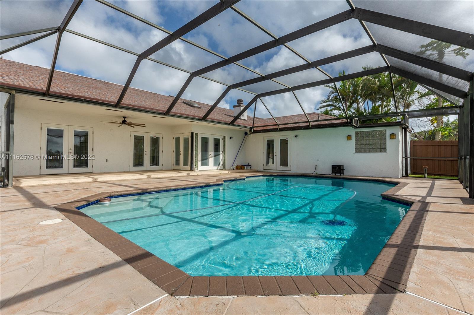 11612 Quiet Waters Lane Boca Raton, FL 33428 - Photo 56 of 70 a view of a house with a backyard