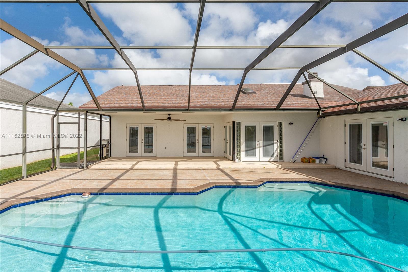 11612 Quiet Waters Lane Boca Raton, FL 33428 - Photo 57 of 70 a house view with a outdoor space