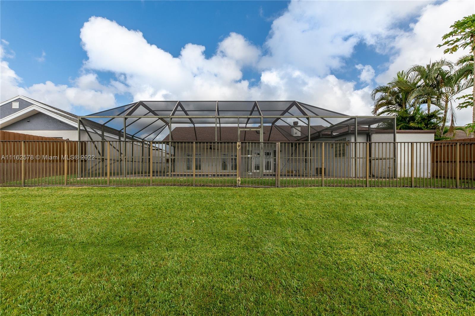 11612 Quiet Waters Lane Boca Raton, FL 33428 - Photo 63 of 70 a view of a house with a backyard