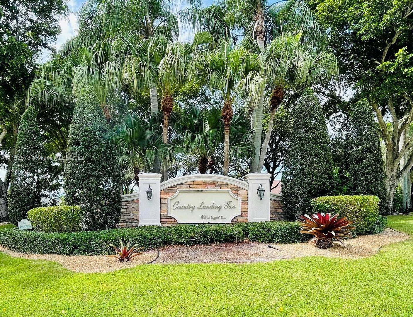 11612 Quiet Waters Lane Boca Raton, FL 33428 - Photo 70 of 70 a view of a house with a yard and sitting area