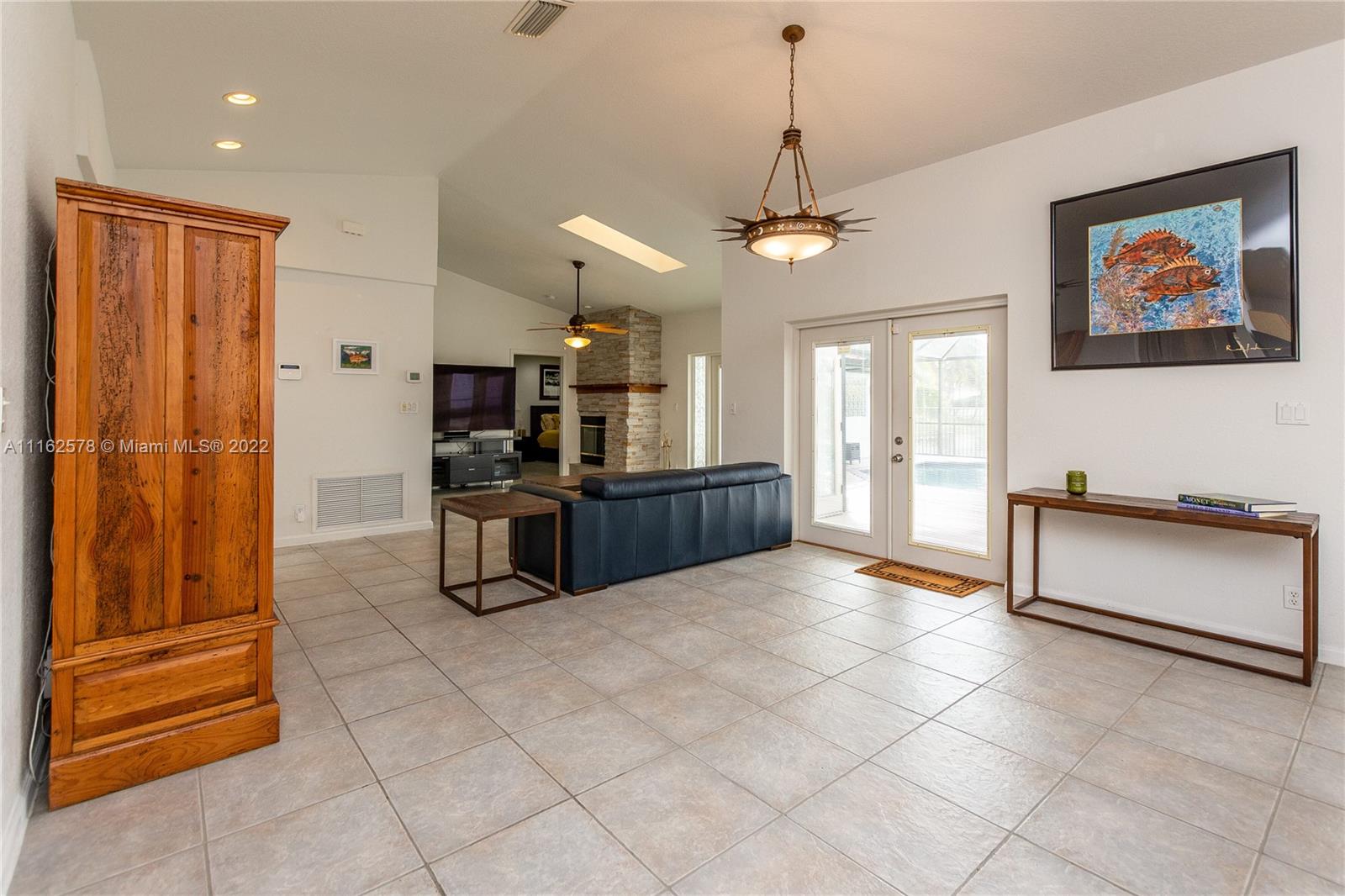 11612 Quiet Waters Lane Boca Raton, FL 33428 - Photo 8 of 70 a kitchen with stainless steel appliances granite countertop a refrigerator and a stove top oven