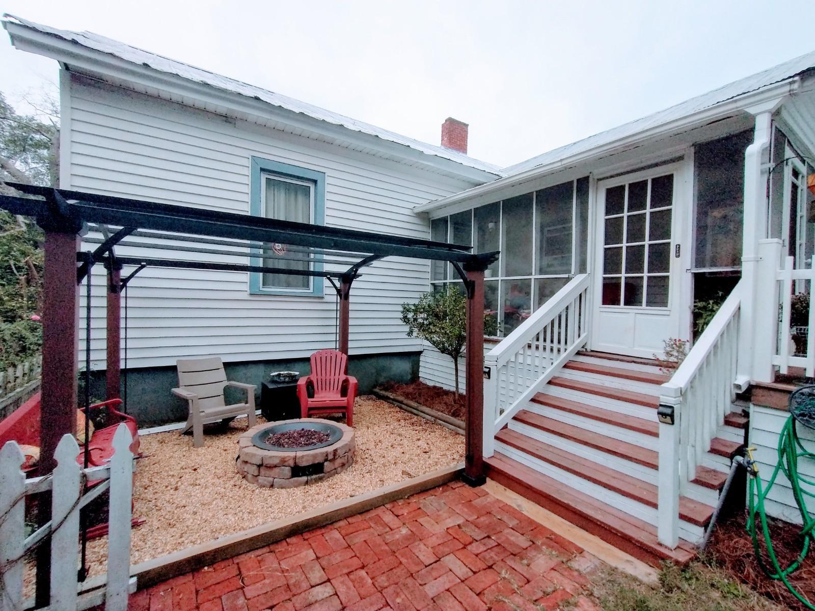 12432 Deerfield Road Savannah, GA 31419 - Photo 18 of 20 fire pit & screened in porch