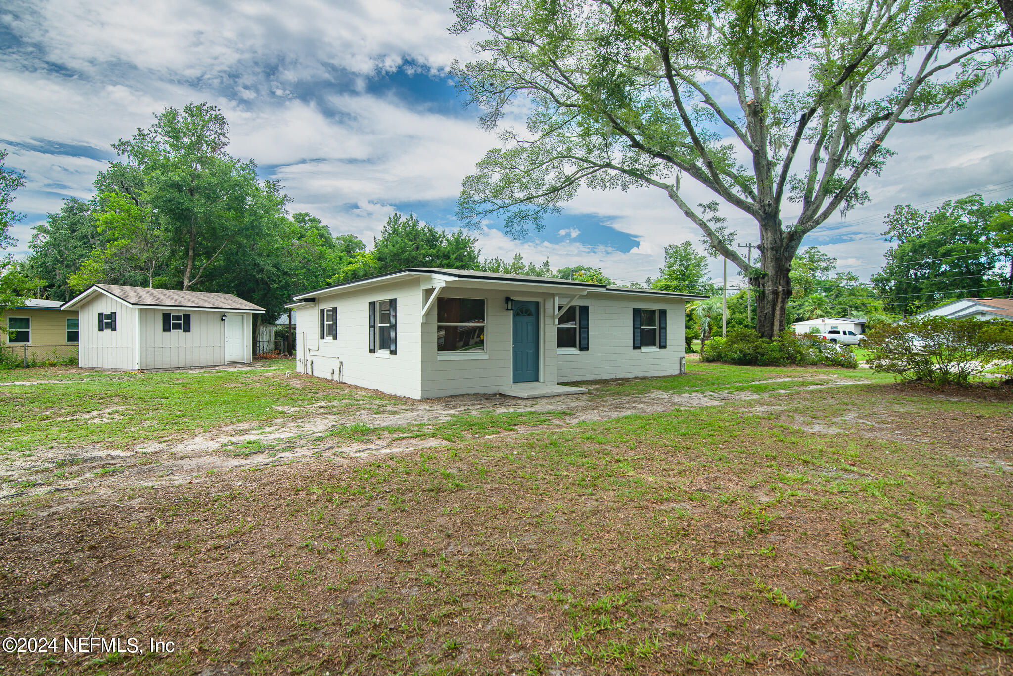 1702 King Arthur Road Jacksonville, FL 32211 - Photo 1 of 24 a view of a house with a backyard