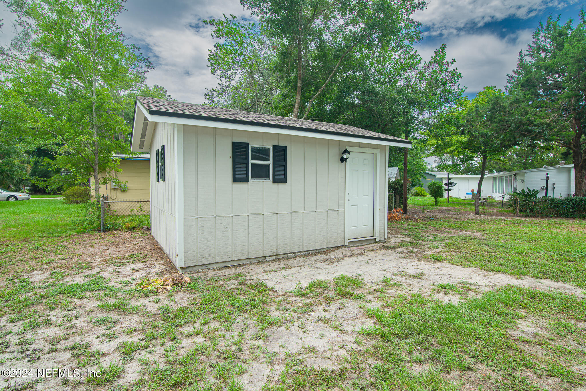 1702 King Arthur Road Jacksonville, FL 32211 - Photo 20 of 24 a view of a house with a yard