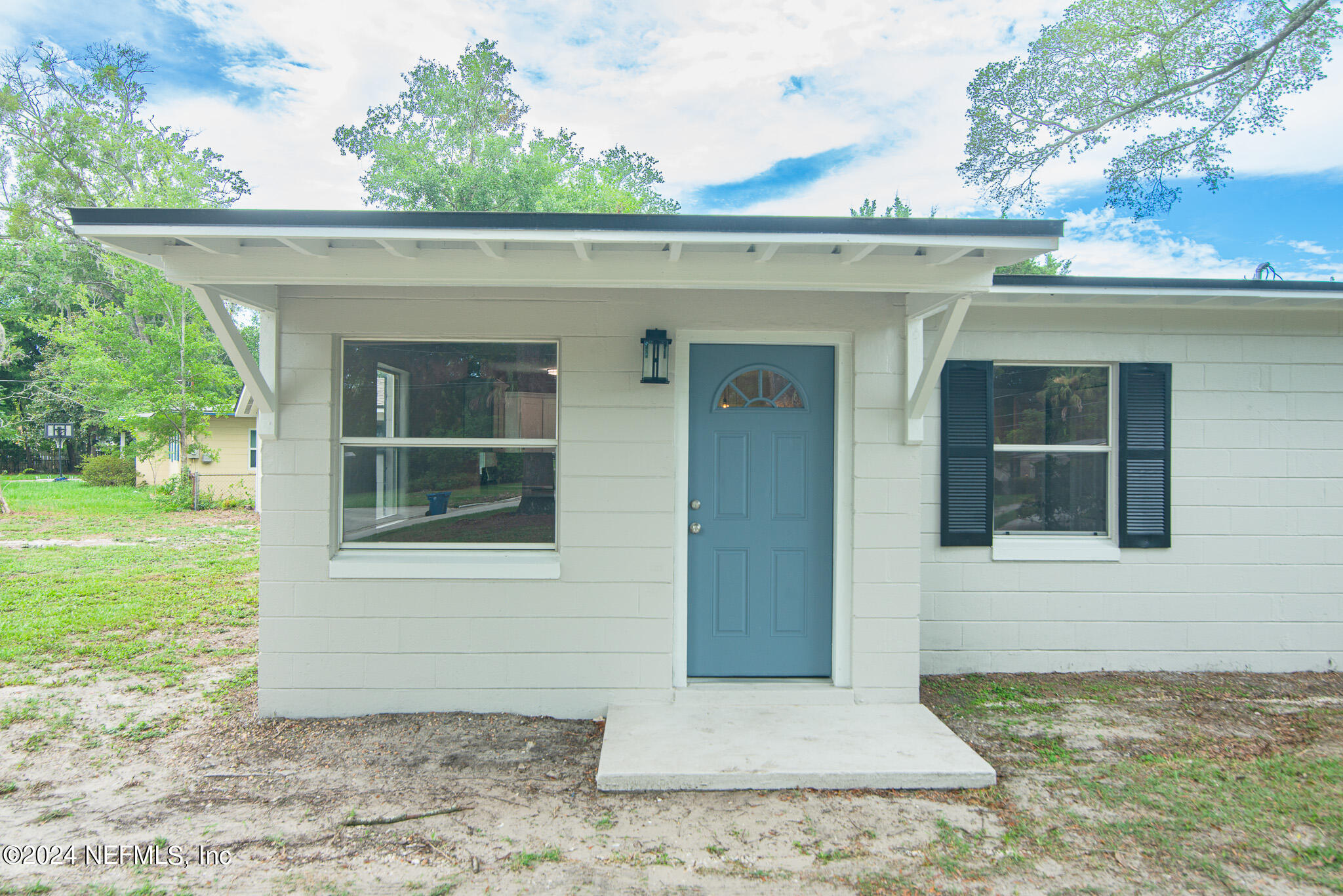 1702 King Arthur Road Jacksonville, FL 32211 - Photo 5 of 24 a front view of a house with a yard