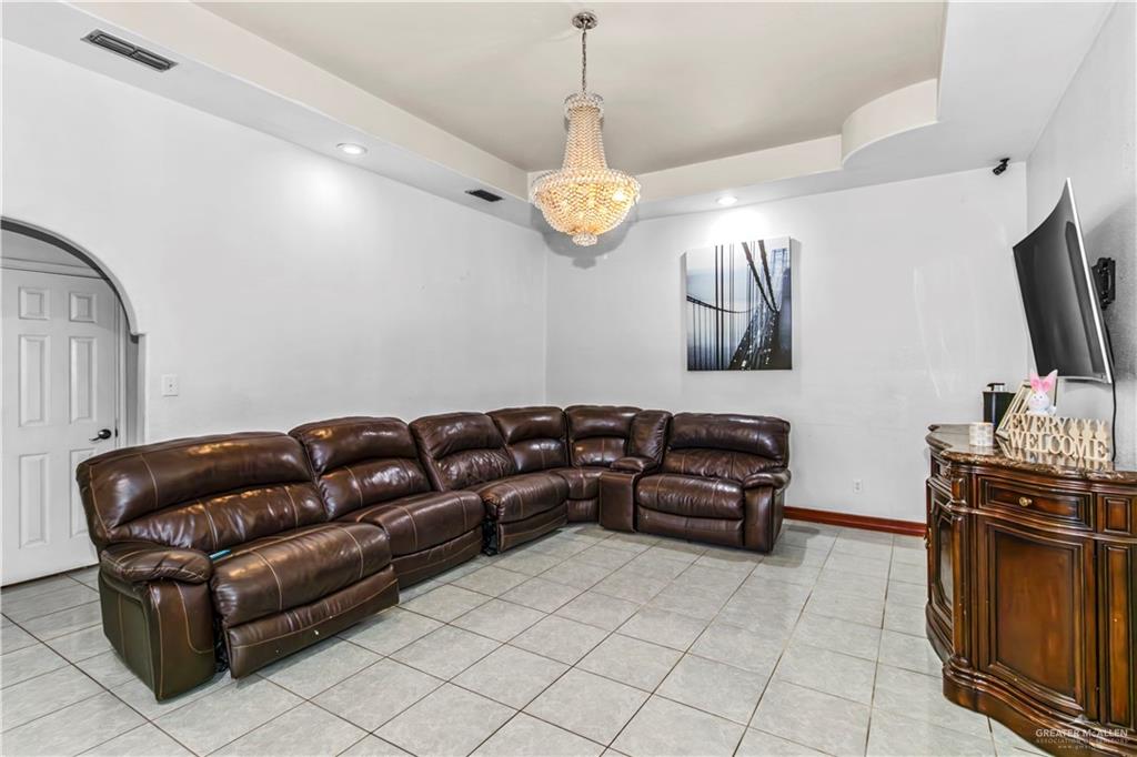2509 Coma Street Hidalgo, TX 78557 - Photo 4 of 12 a living room with furniture and a flat screen tv