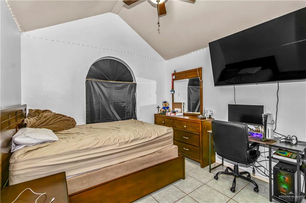 2509 Coma Street Hidalgo, TX 78557 - Photo 10 of 12 a bedroom with a bed and a flat screen tv