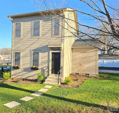 front view of a house with a yard