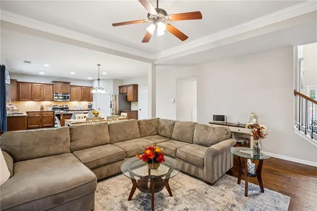 a living room with furniture fireplace and flat screen tv