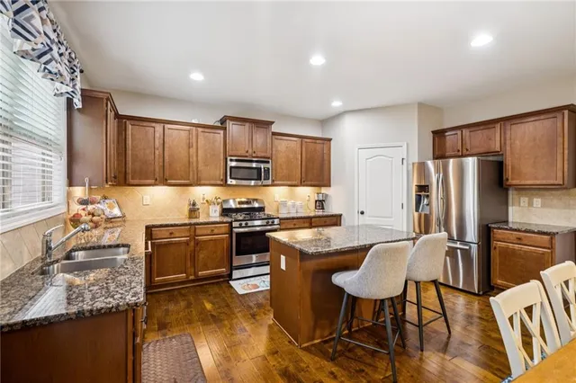 a view of balcony with wooden floor and outdoor seating