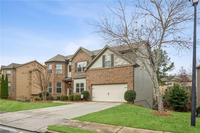 front view of a house with a yard