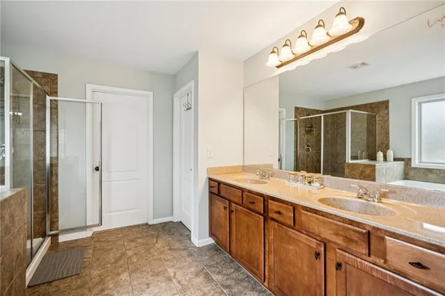 a bathroom with a sink toilet and a mirror