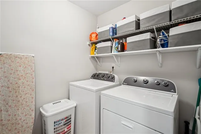 a kitchen with cabinets and window