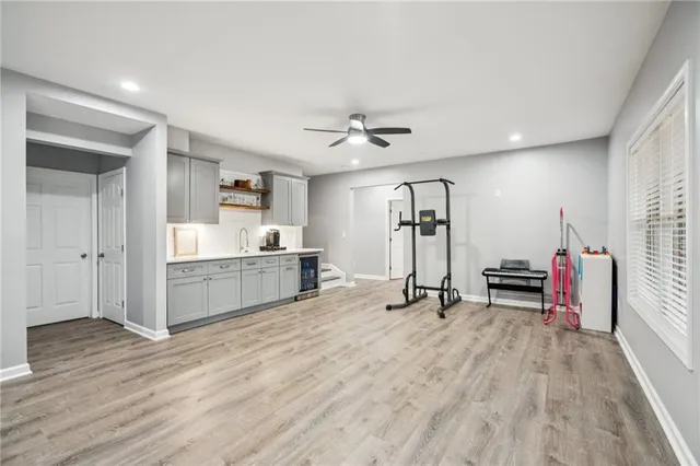 a view of a house with a big yard and large trees