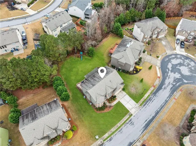 an aerial view of a house with a swimming pool