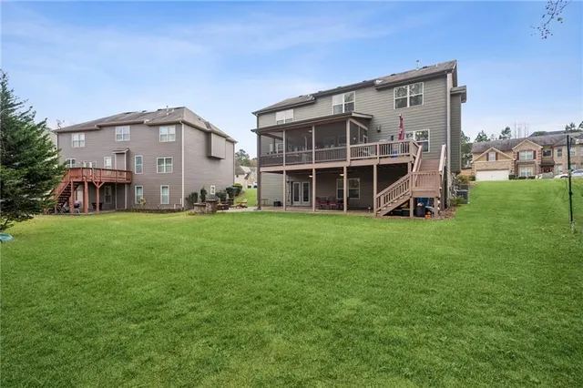 an aerial view of a house with a swimming pool