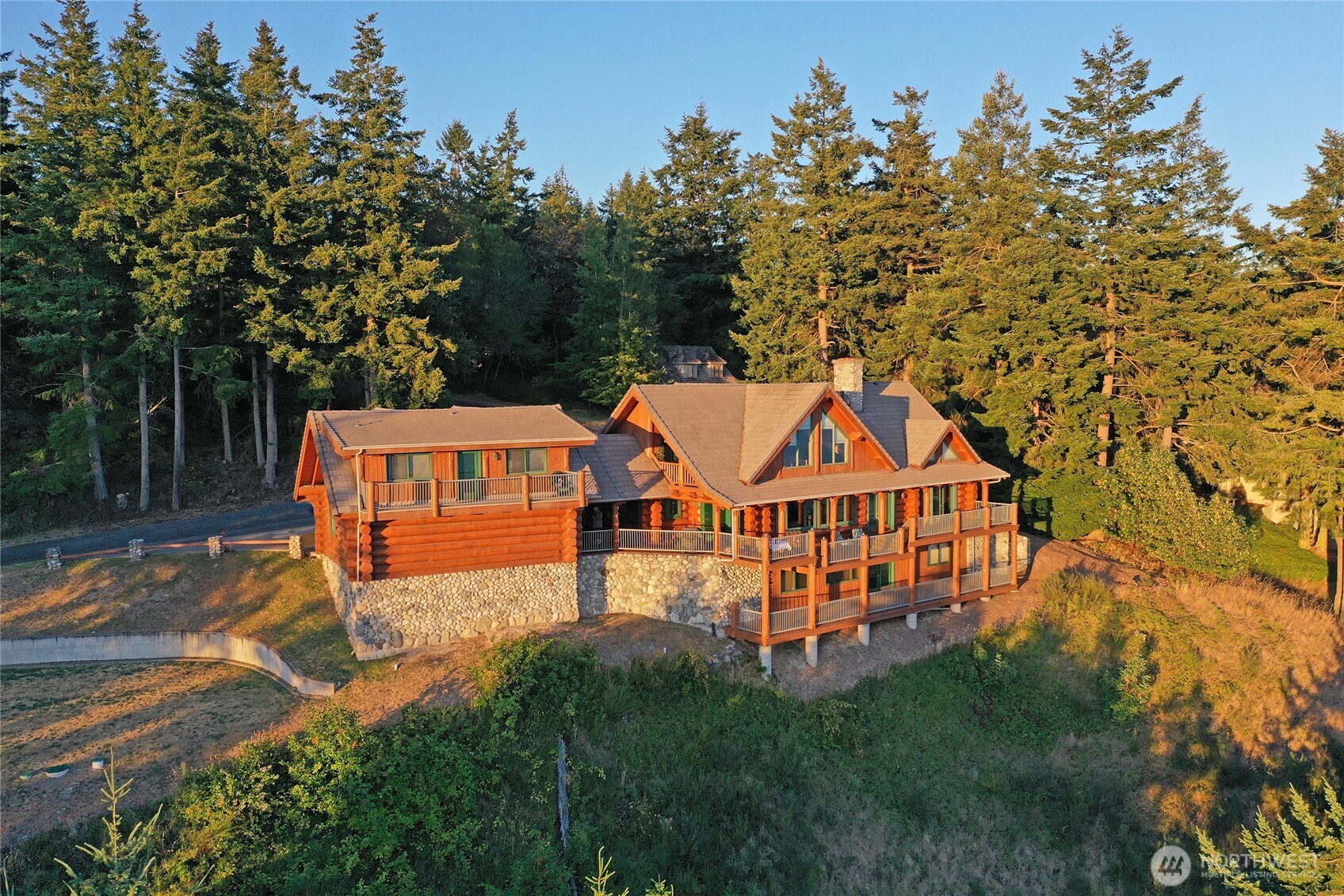 53 Combs Place Port Townsend, WA 98368 - Photo 40 of 40 an aerial view of residential houses with yard and trees in the background