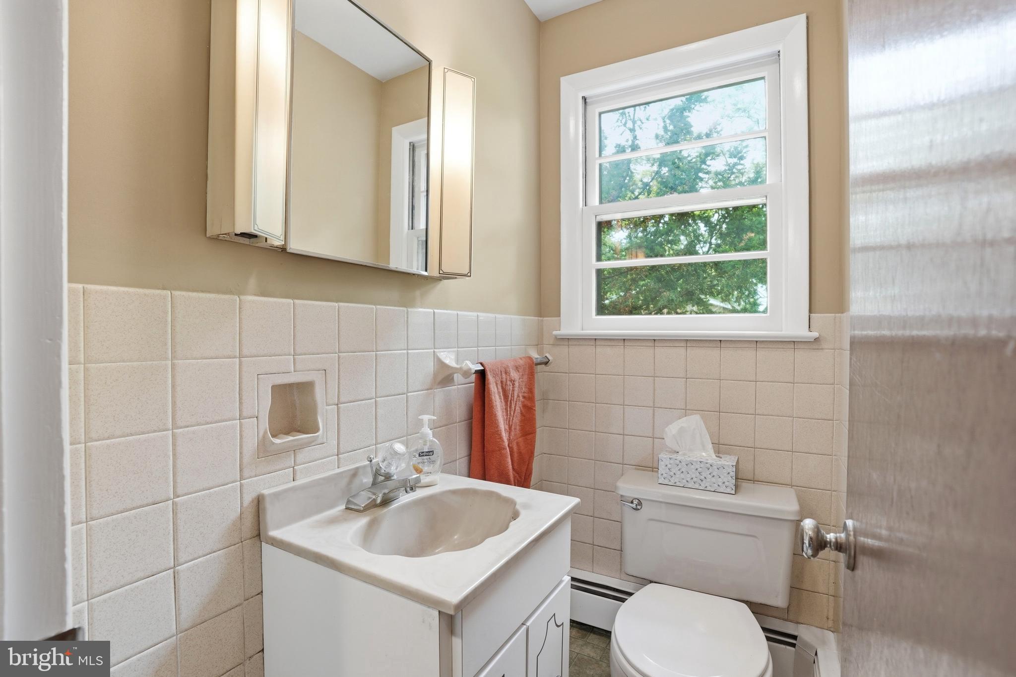 486 Derstine Road Hatfield, PA 19440 - Photo 17 of 53 a bathroom with a toilet a sink and mirror