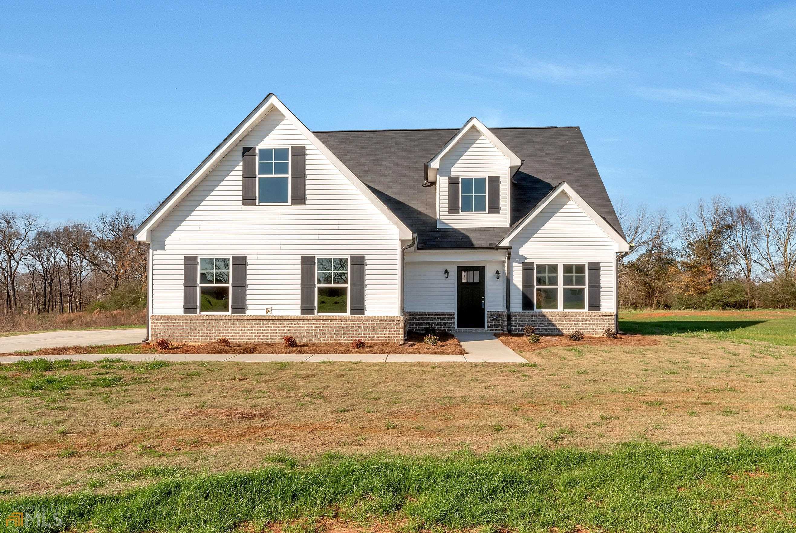 128 Neal Little Road, Unit 7 Carnesville, GA 30521 - Photo 1 of 1 a front view of a house with a yard