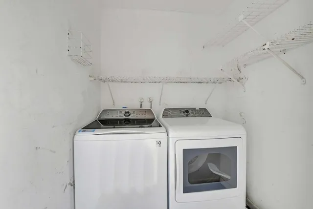 a utility room with dryer and washer