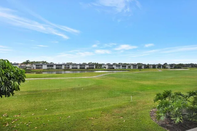 a view of an ocean with a building in the background