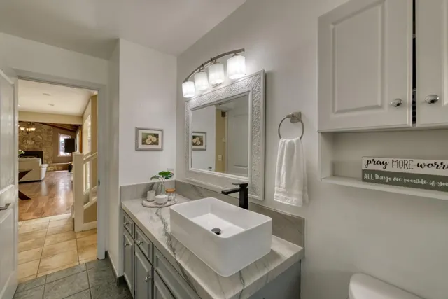 a white stove top oven sitting inside of a kitchen