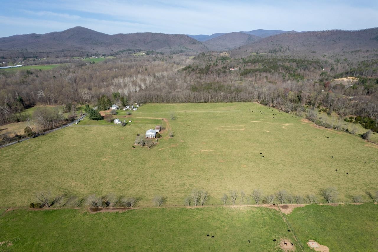 512 North River Road Mount Solon, VA 22843 - Photo 34 of 38 a view of a lush green hillside and houses