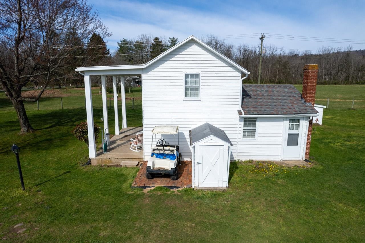 512 North River Road Mount Solon, VA 22843 - Photo 7 of 38 a view of a house with a backyard and a garden