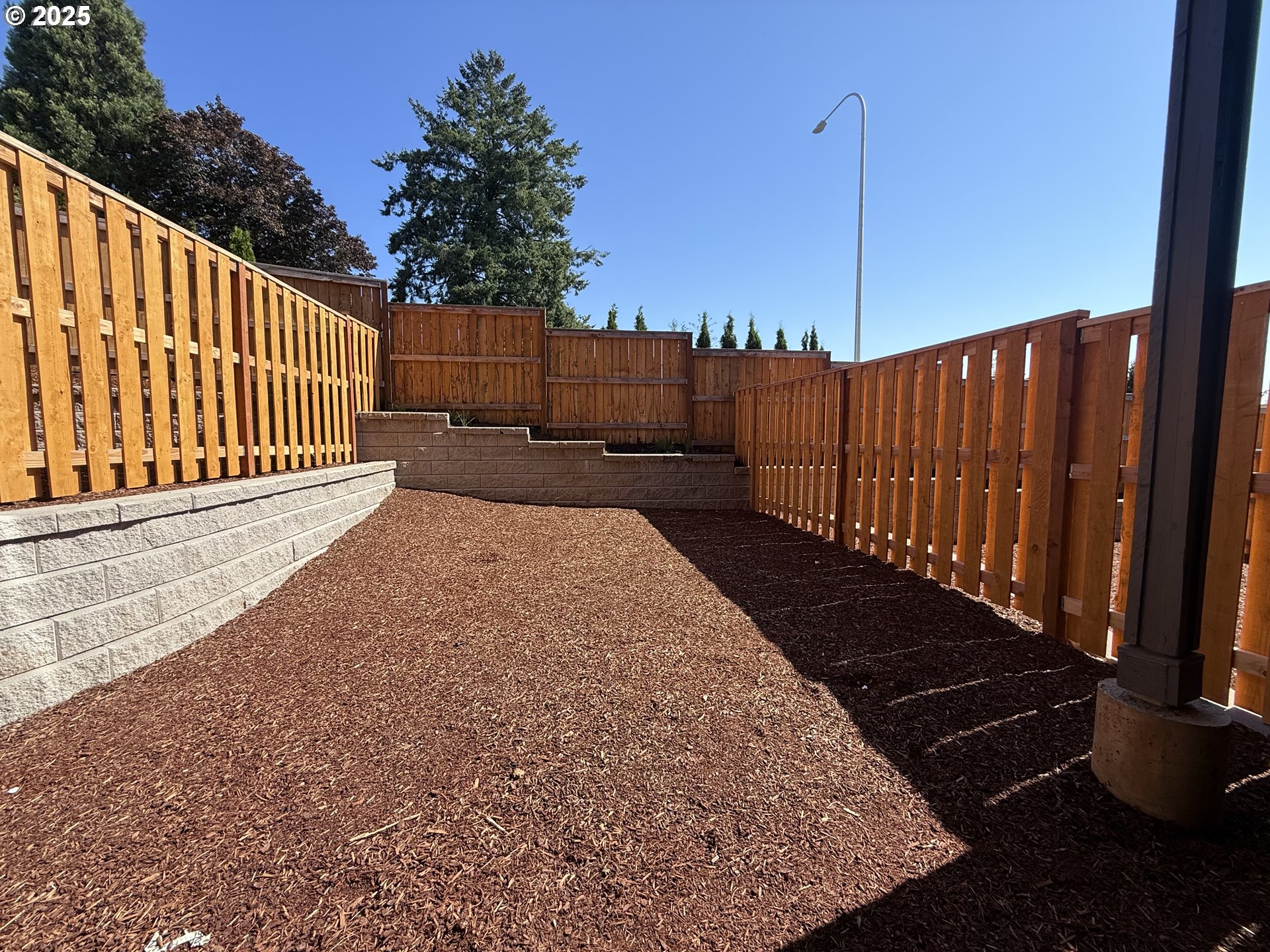 11910 Southwest 176th Drive Beaverton, OR 97007 - Photo 11 of 11 a view of a backyard with wooden fence