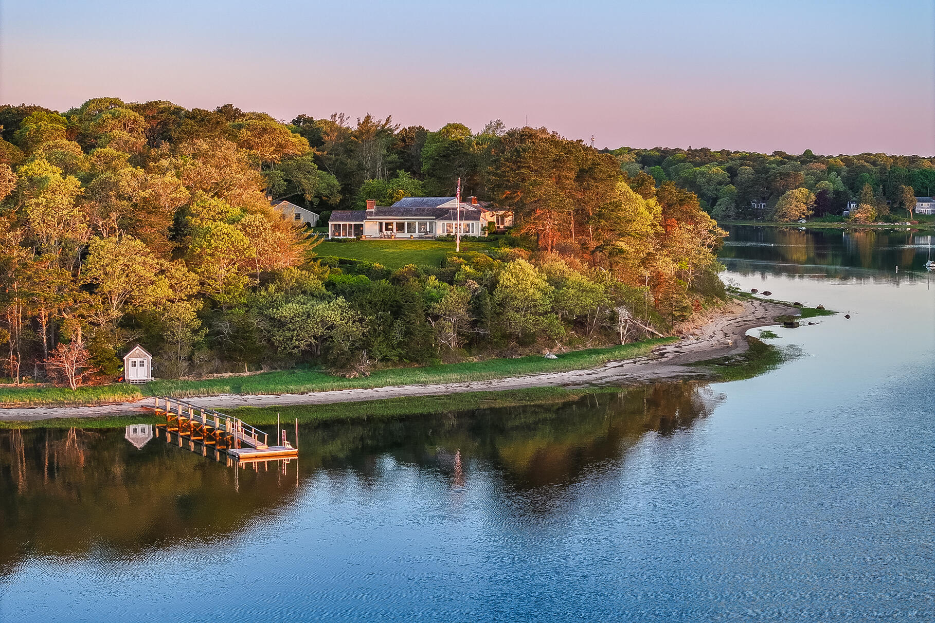 74-75 Viking Road Orleans, MA 02653 - Photo 1 of 69 a view of a lake with a mountain in the background