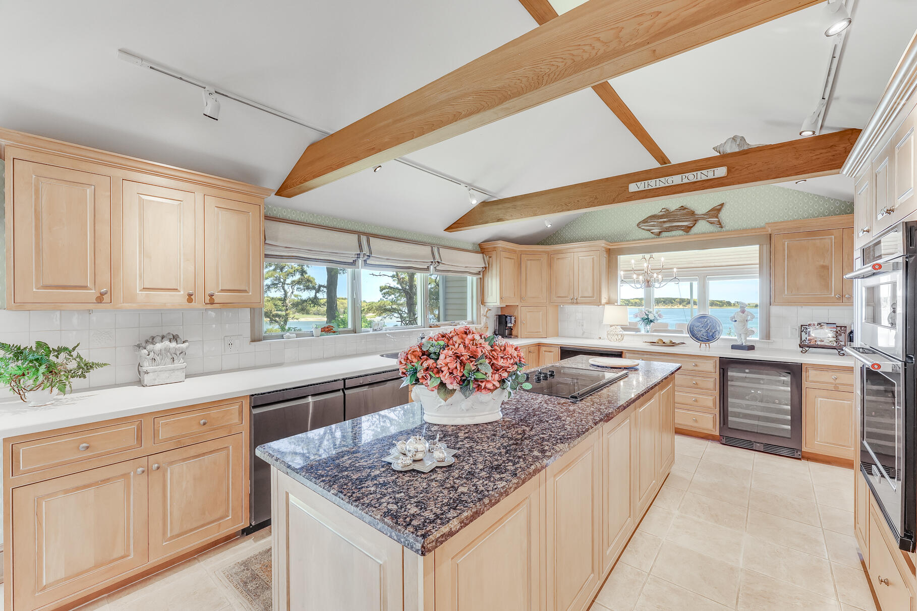 74-75 Viking Road Orleans, MA 02653 - Photo 15 of 69 a kitchen with stainless steel appliances kitchen island granite countertop a sink and cabinets