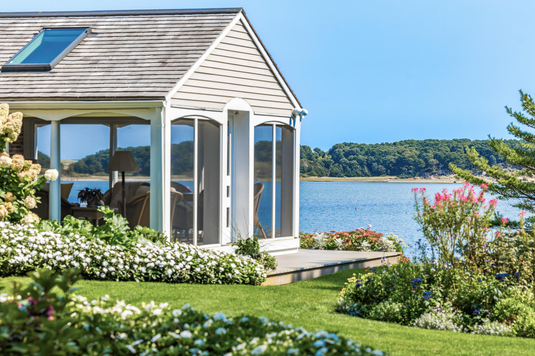 74-75 Viking Road Orleans, MA 02653 - Photo 29 of 69 a front view of a house with a yard and potted plants