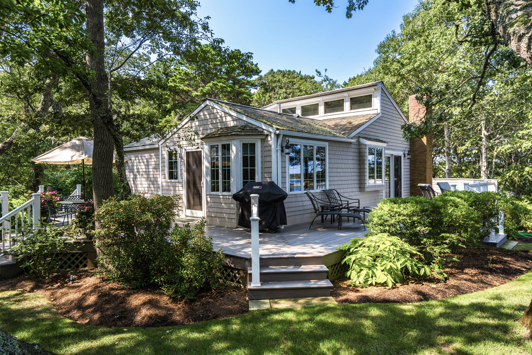 74-75 Viking Road Orleans, MA 02653 - Photo 37 of 69 a front view of a house with garden