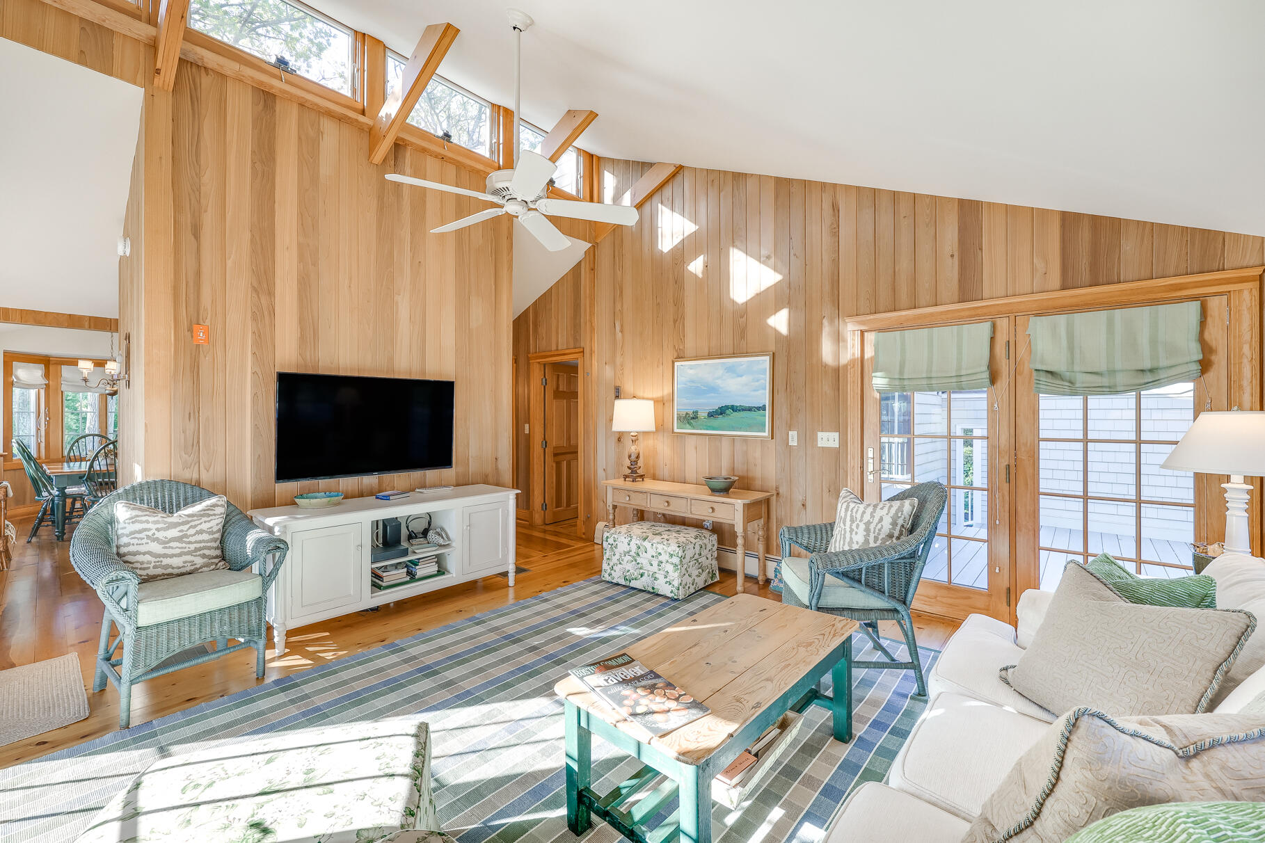 74-75 Viking Road Orleans, MA 02653 - Photo 43 of 69 a living room with furniture a flat screen tv and a window