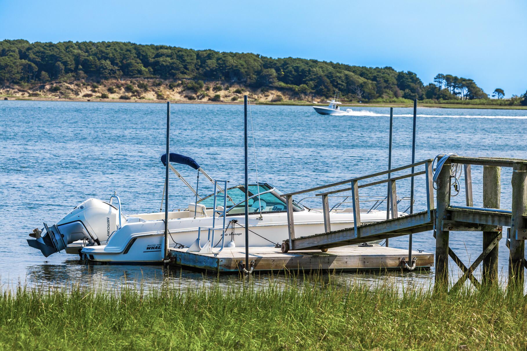 74-75 Viking Road Orleans, MA 02653 - Photo 64 of 69 a view of a lake with a house in the background