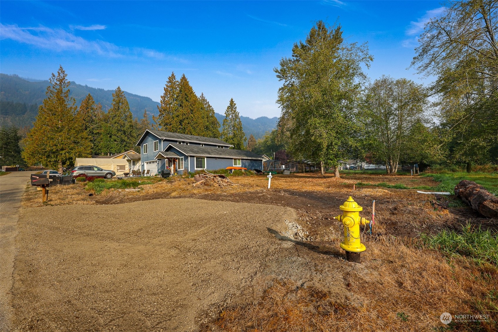 3026 Beaver Place Sedro-Woolley, WA 98284 - Photo 4 of 21 a view of a swimming pool with an outdoor space and seating area