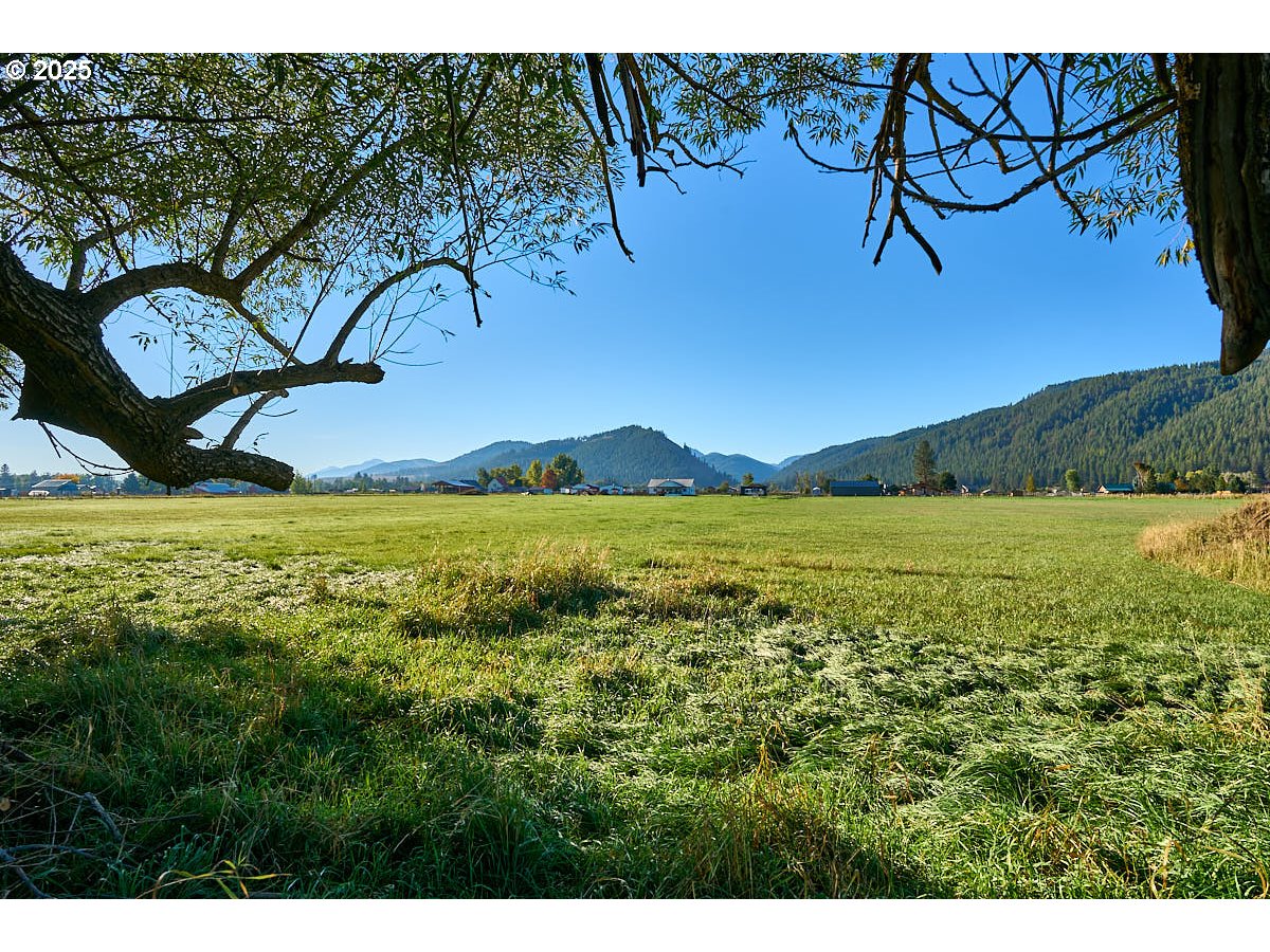 Upper Diamond Lane Wallowa, OR 97885 - Photo 8 of 13 a view of a lake with a table and chairs