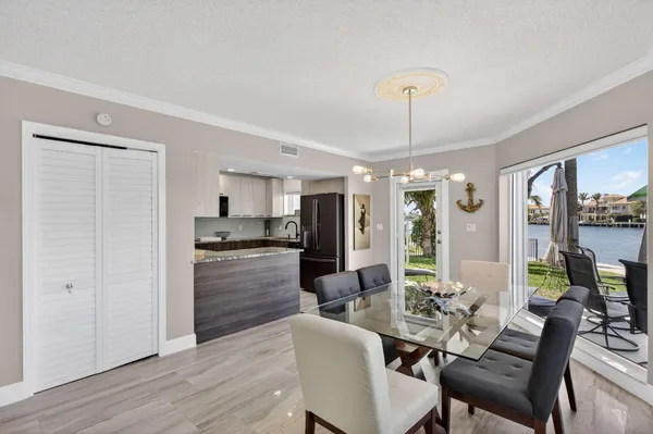 a view of a dining room with furniture window and outside view