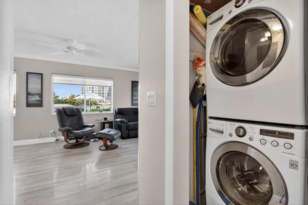 a view of a storage and utility room with washer and dryer
