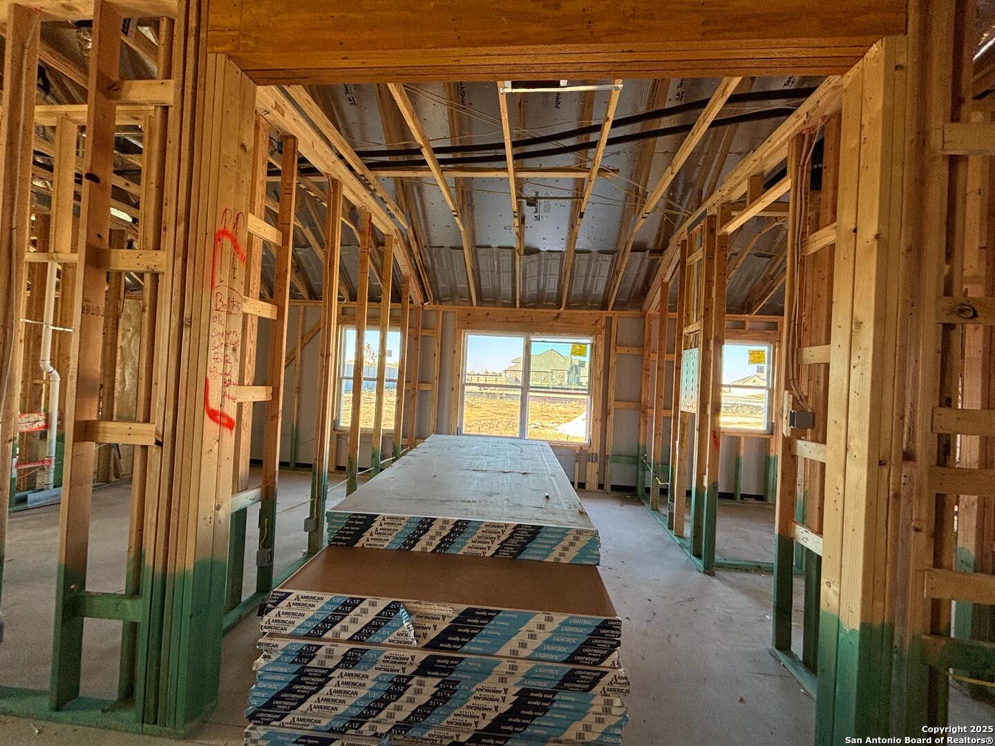 10131 Dew Rdg Way Schertz, TX 78154 - Photo 22 of 41 a living room with a bed and a chandelier
