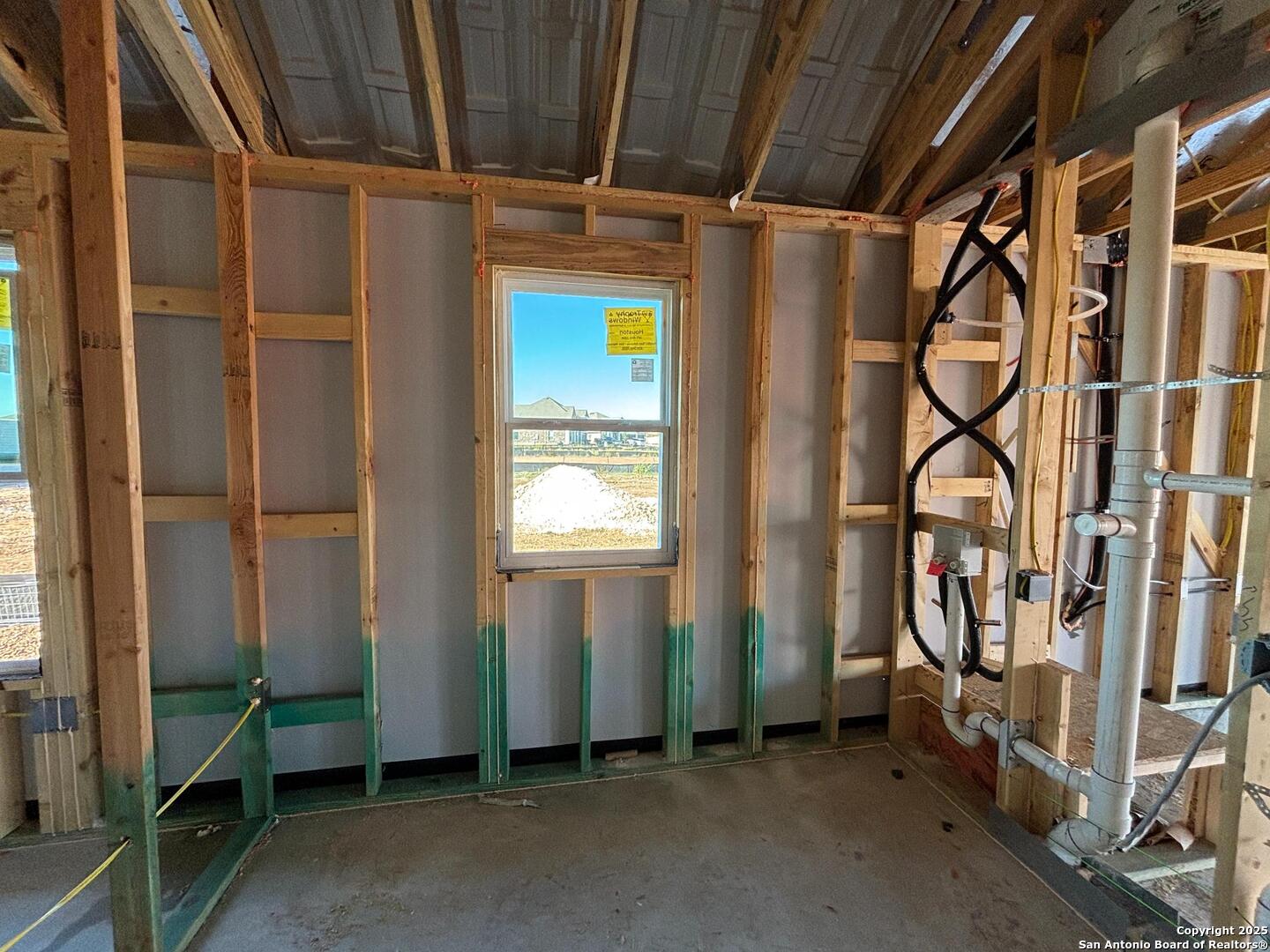 10131 Dew Rdg Way Schertz, TX 78154 - Photo 29 of 41 a view of an empty room with wooden floor and windows