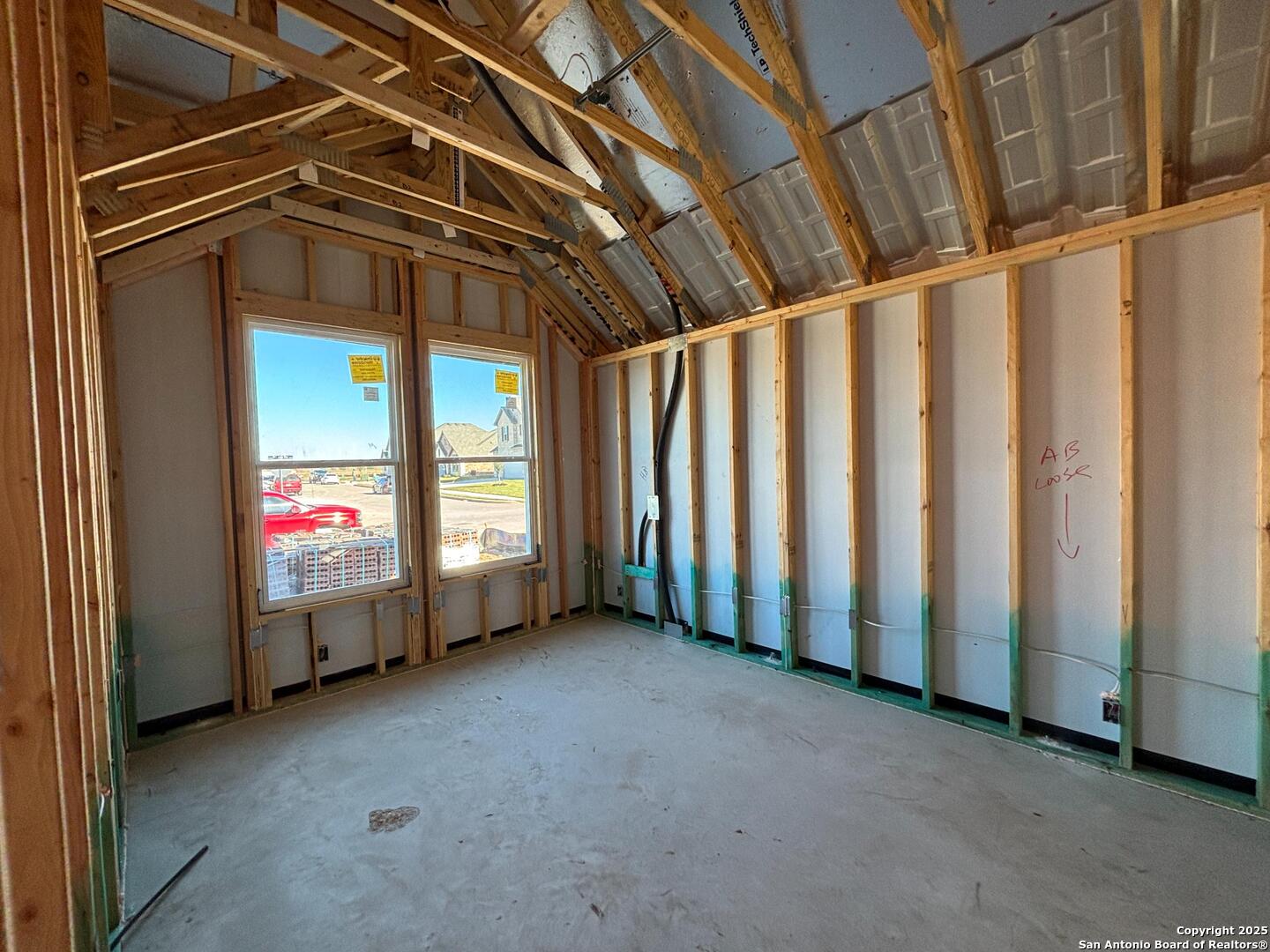 10131 Dew Rdg Way Schertz, TX 78154 - Photo 31 of 41 a view of an empty room with window stairs and a fireplace