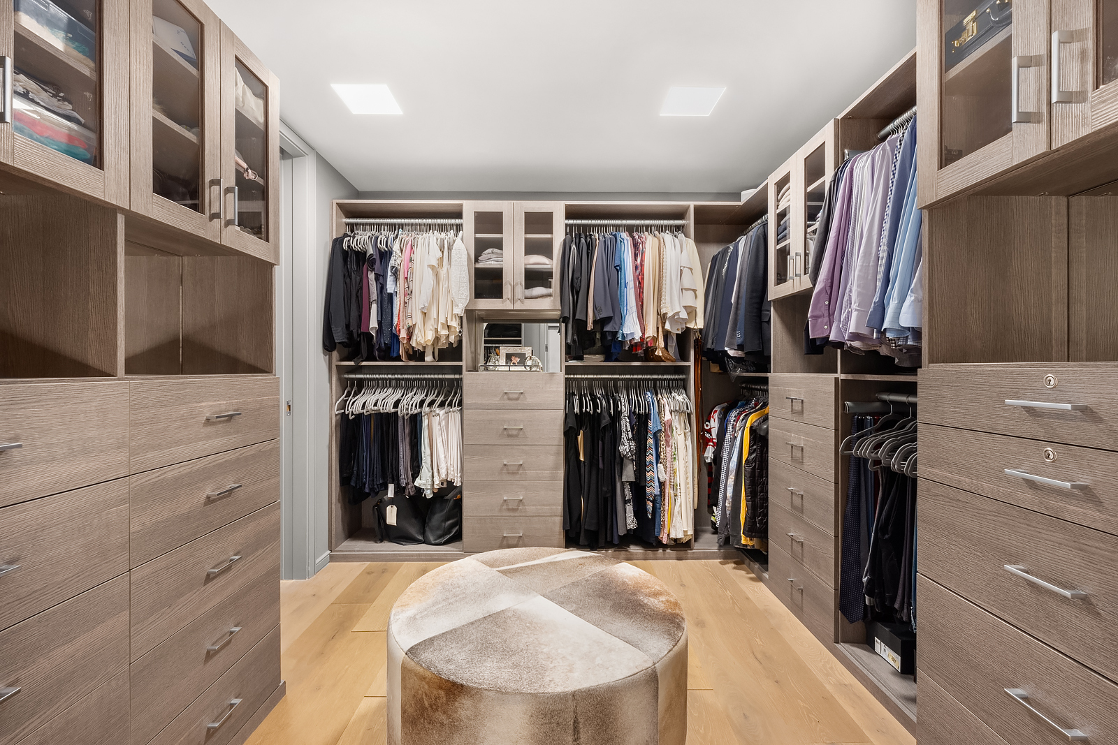 11 Beach Street, Unit 8A Manhattan, NY 10013 - Photo 10 of 23 a view of walk in closet with clothes and shoes