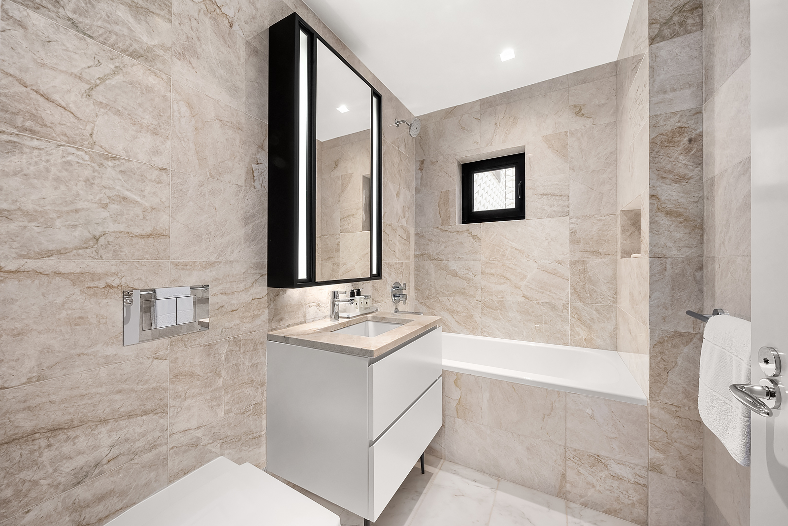 11 Beach Street, Unit 8A Manhattan, NY 10013 - Photo 13 of 23 a bathroom with a sink a toilet and shower