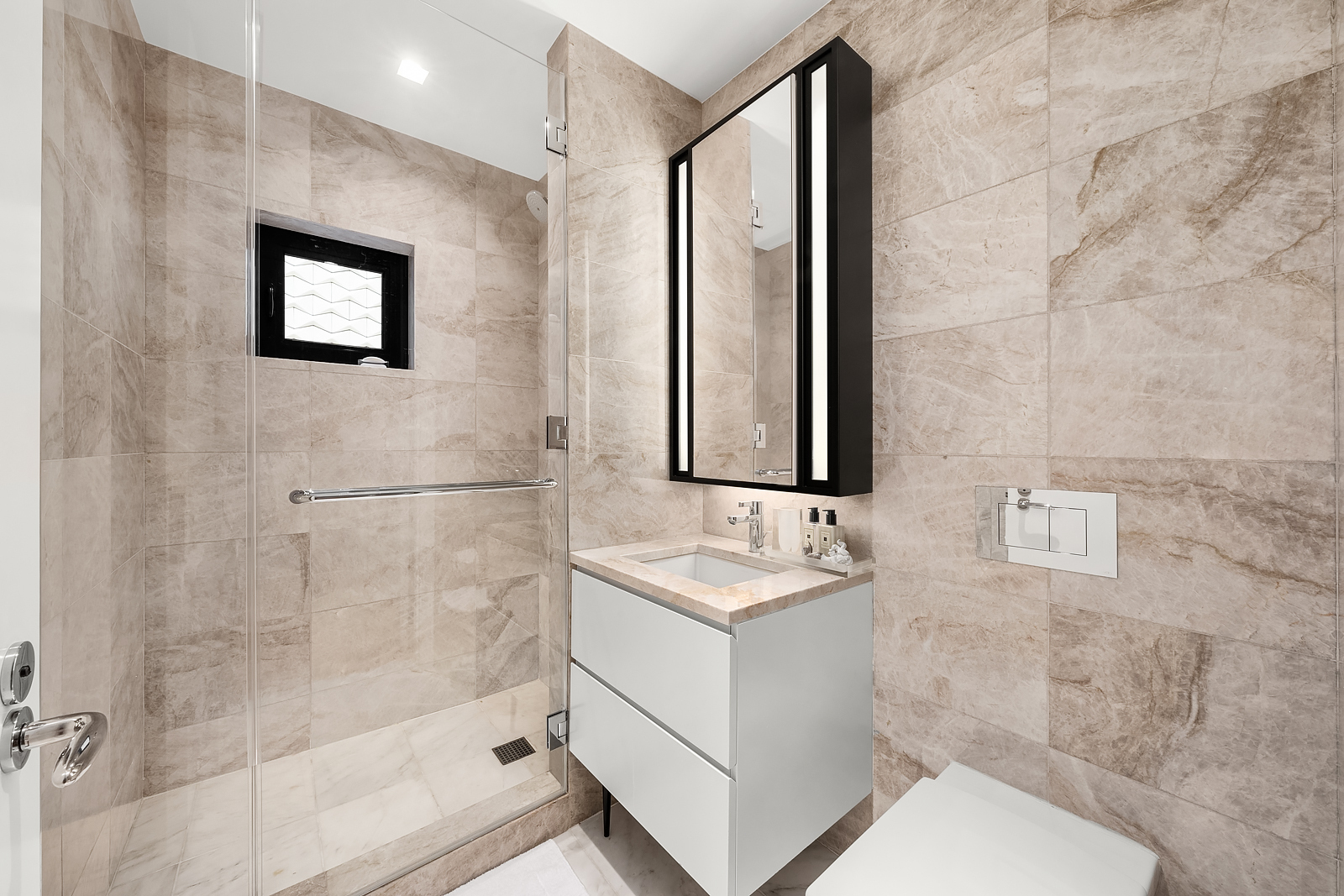 11 Beach Street, Unit 8A Manhattan, NY 10013 - Photo 15 of 23 a bathroom with a toilet sink and shower