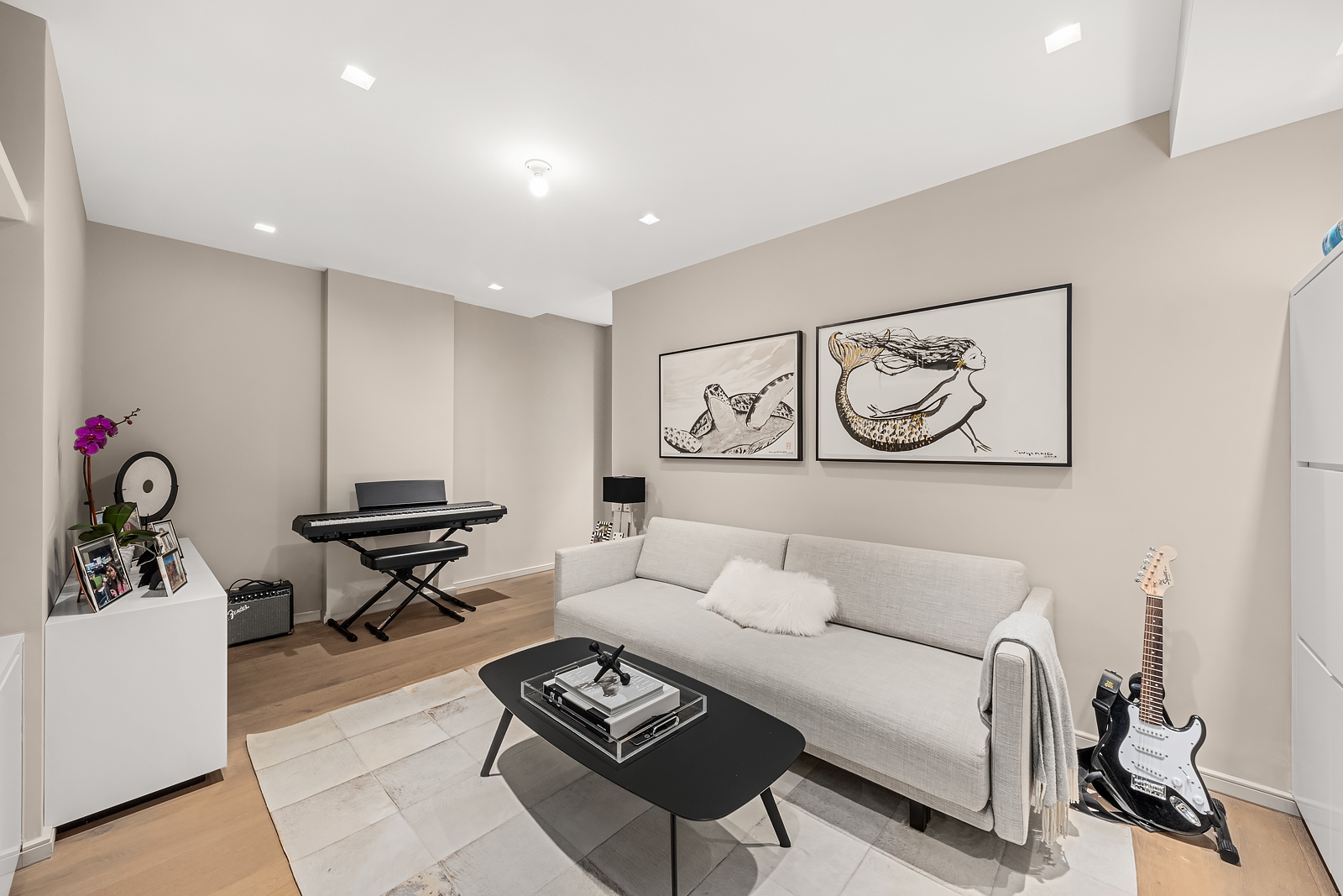 11 Beach Street, Unit 8A Manhattan, NY 10013 - Photo 16 of 23 a living room with furniture a rug and white walls