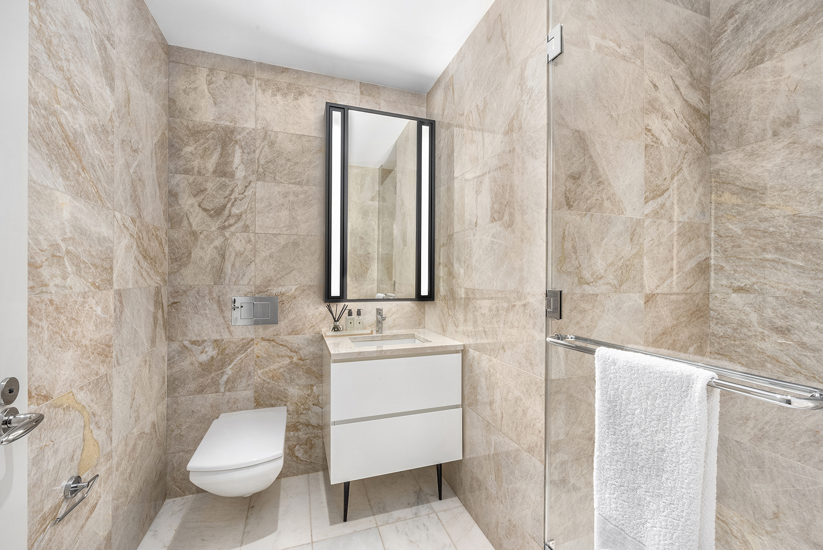 11 Beach Street, Unit 8A Manhattan, NY 10013 - Photo 18 of 23 a bathroom with a sink a toilet and shower