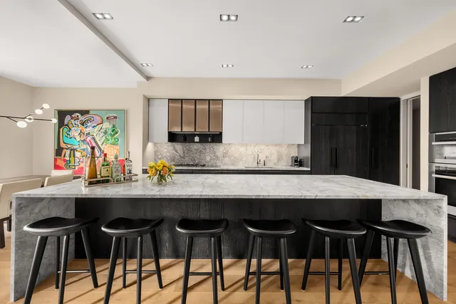 a kitchen with a table and chairs in it